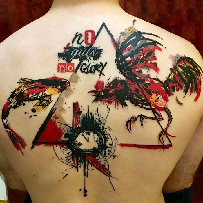 Back with a vivid Trash Polka tattoo featuring a rooster and koi fish, with text saying "no guts no glory".