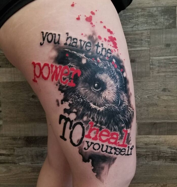 Trash Polka tattoo on thigh featuring an owl and motivational text in red and black.