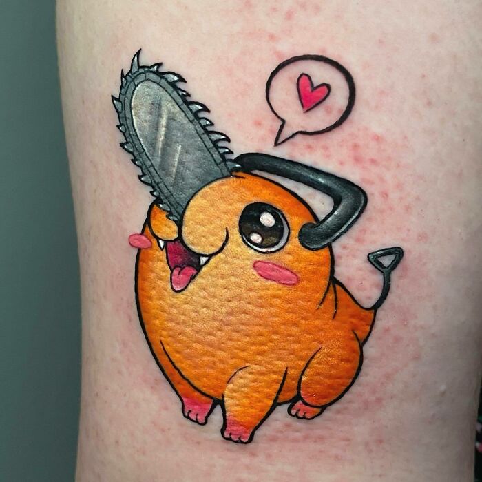 Anime tattoo of a cute orange character with a chainsaw head and heart speech bubble.
