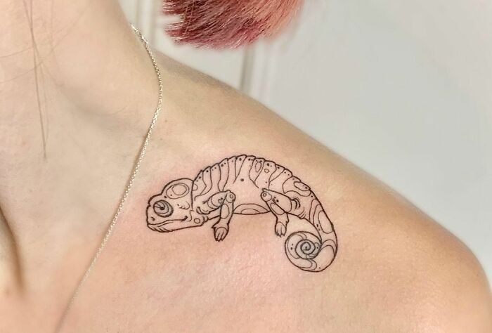 Chameleon collarbone tattoo on a person, showcasing creative body art for men and women.