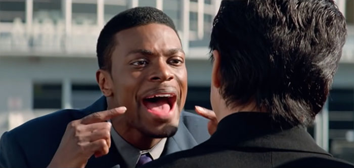 Detective James Carter explaining something expressively