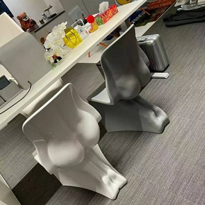 White b**t shaped chairs 