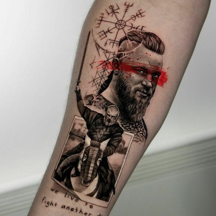 Pop culture tattoo featuring a bearded warrior with red paint, Norse runes, and a battle scene, inked on an arm.