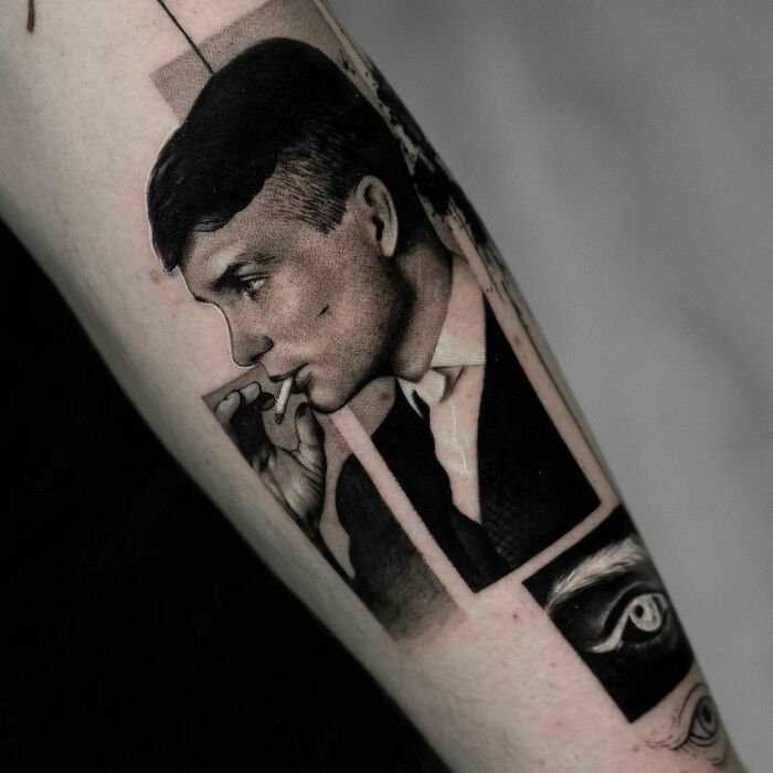 Pop culture tattoo of a man in profile, elegantly detailed on an arm, evoking vintage style and charm.