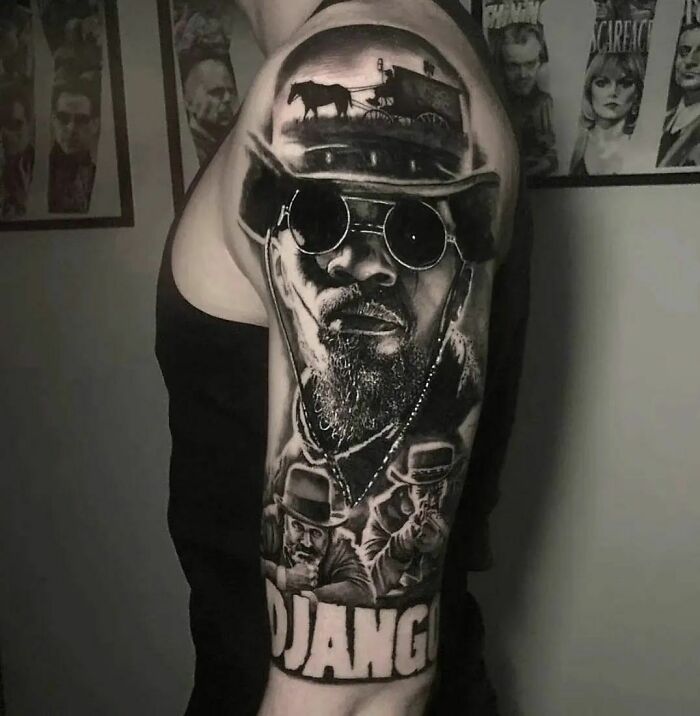 Pop culture tattoo featuring a detailed portrait inspired by the movie Django, with a western theme, on a person's arm.