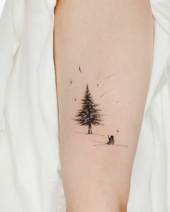 Small tree tattoo with stars and crescent moon, celebrating the wonders of nature.