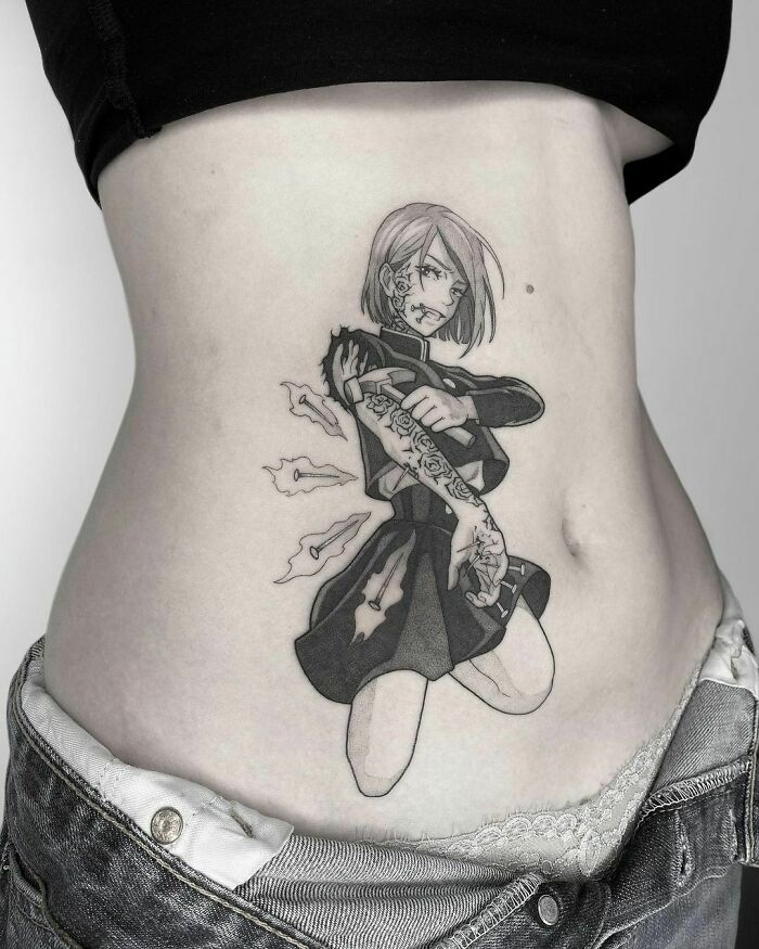 Pop culture tattoo of a dynamic anime character with roses on a person's abdomen, showcasing intricate design details.