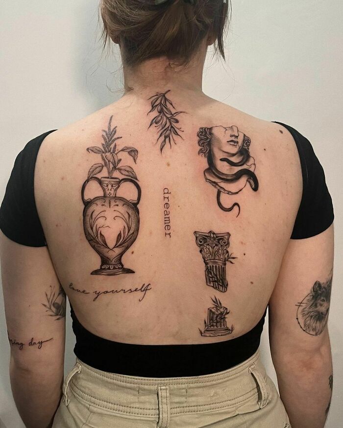 Woman displaying patchwork tattoos on her back featuring various detailed designs.
