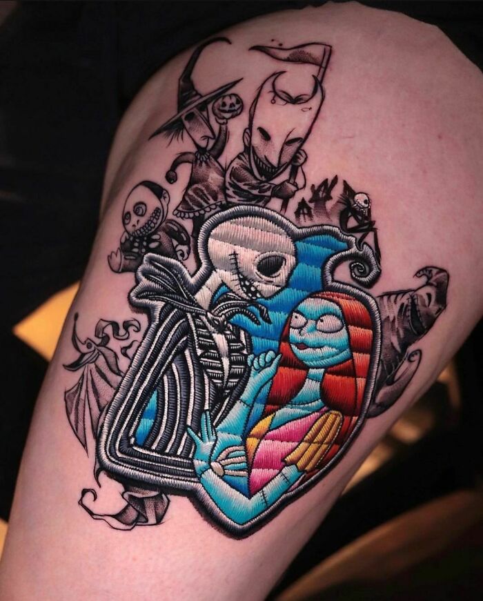 Pop culture tattoo of iconic characters in vivid colors on upper arm.