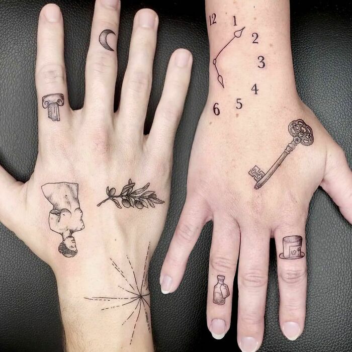 Hand tattoos featuring patchwork designs: clock, key, column, moon, leaf, and bottle, showcasing unique artistic styles.