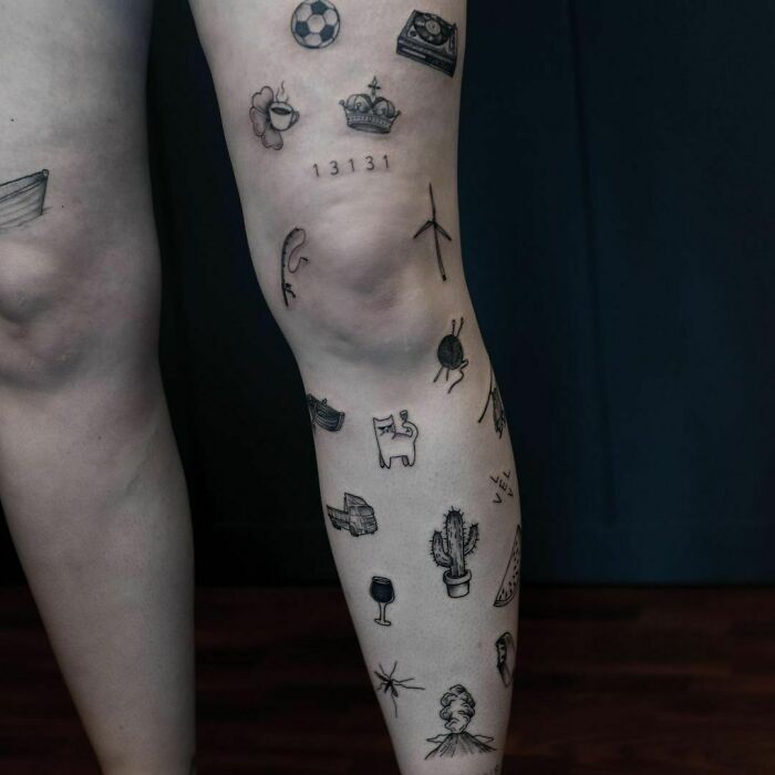 Patchwork tattoo designs featuring small, unique symbols on a leg, showcasing modern ink art style.