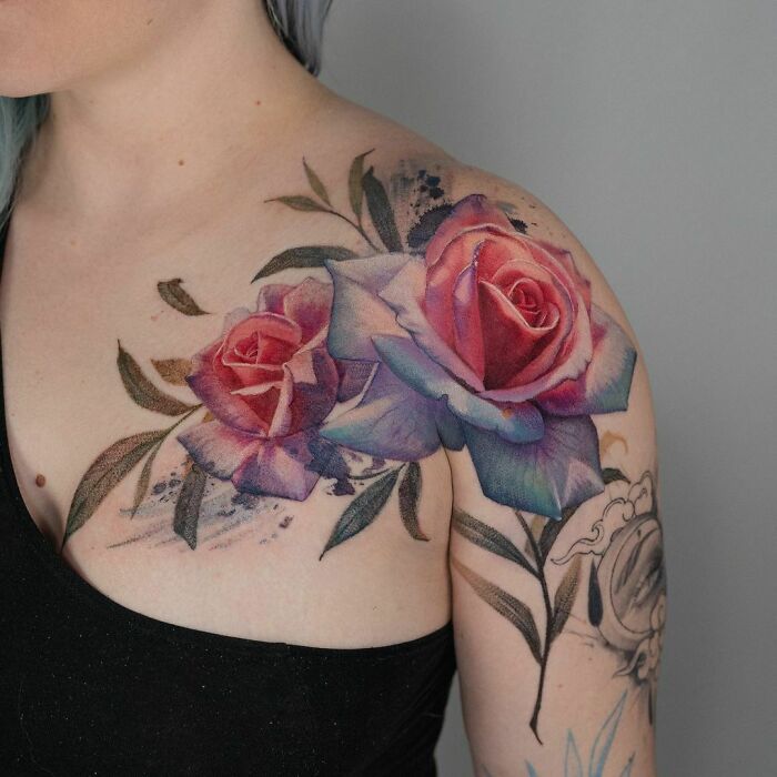 Vibrant rose collarbone tattoo design on a woman's shoulder, showcasing intricate details and vivid colors.