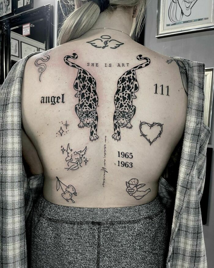 Person with intricate patchwork tattoos on their back, including leopards and angel motifs.