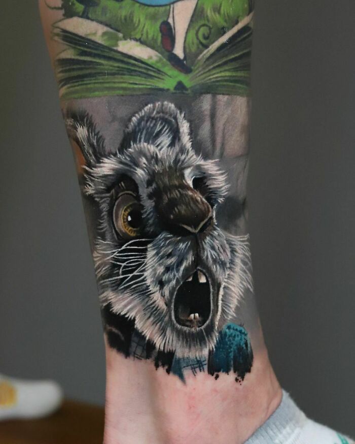 Realistic pop culture tattoo of an expressive rabbit face, showcasing vibrant colors and detailed artwork.