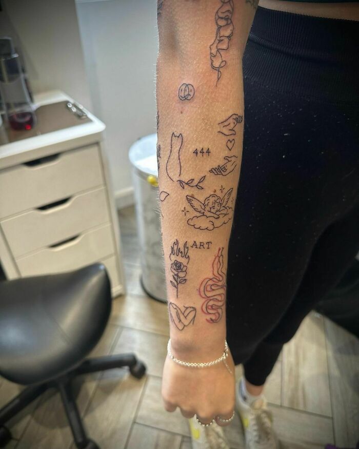 Minimalist patchwork tattoo on forearm with various small designs in an indoor setting.