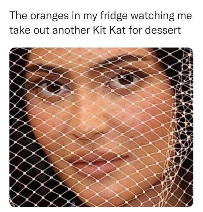 Close-up of a woman behind a net, with text humorously depicting oranges observing a dessert choice.