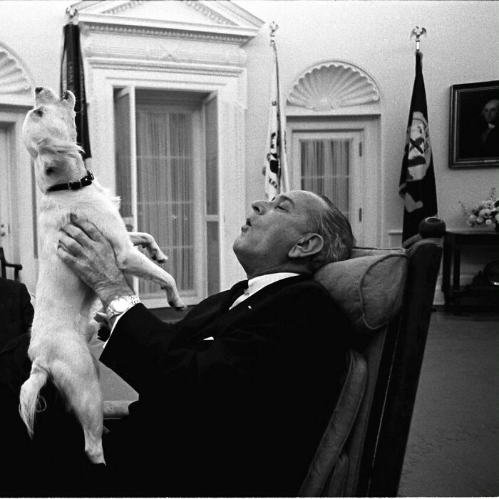 Lyndon B. Johnson Singing With His Dog Yuki In 1968
