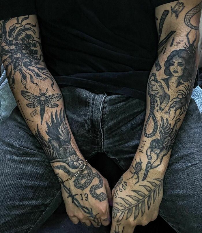 Patchwork tattoo sleeves displaying various designs on both arms, including flowers, a moth, and figures.