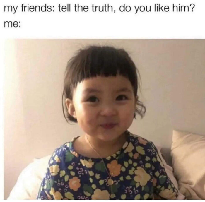 A toddler making a mischievous face, perfect for hilarious memes.