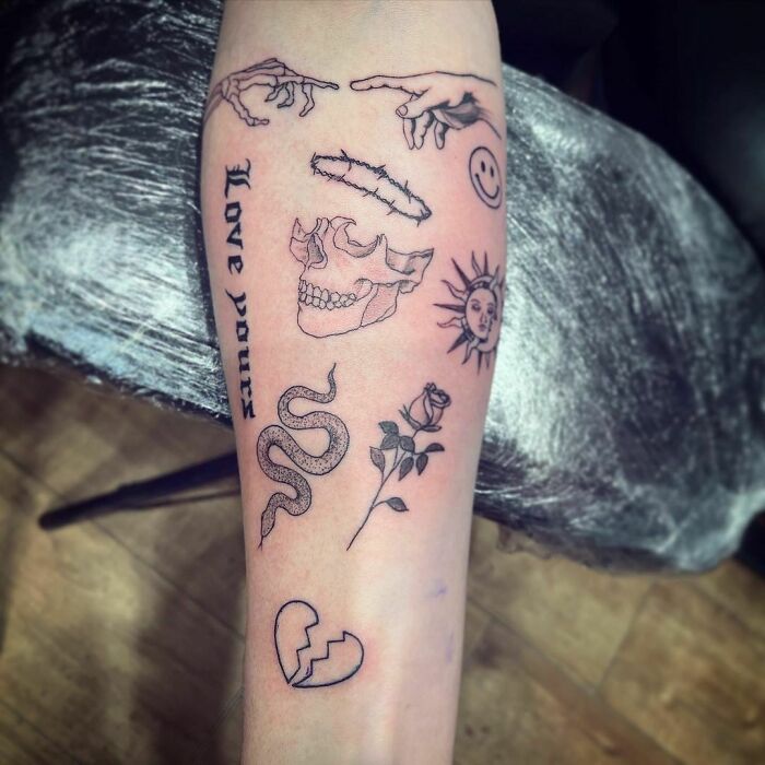 Patchwork tattoo on arm with skull, snake, rose, and hand designs, combining various artistic elements.