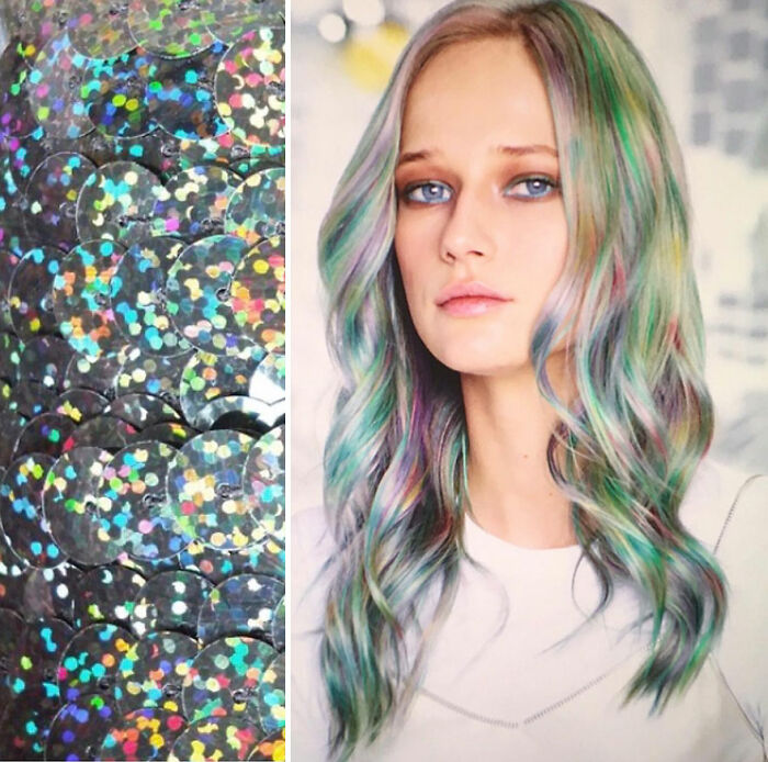 Pastel rainbow hair design by Kansas-based hairstylist Ursula Goff featuring soft waves and multi-colored highlights.