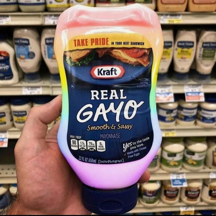 Kraft mayonnaise bottle with "Real Gayo" label, rainbow colors for Pride Month in a grocery store aisle.