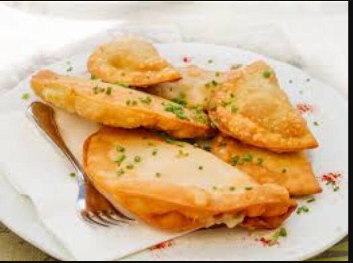 Austria! Zillertaler Krapfen. A Pocket Full With Potatoes An Cheese, And A Glass Of Milk With It. Hits The Spot