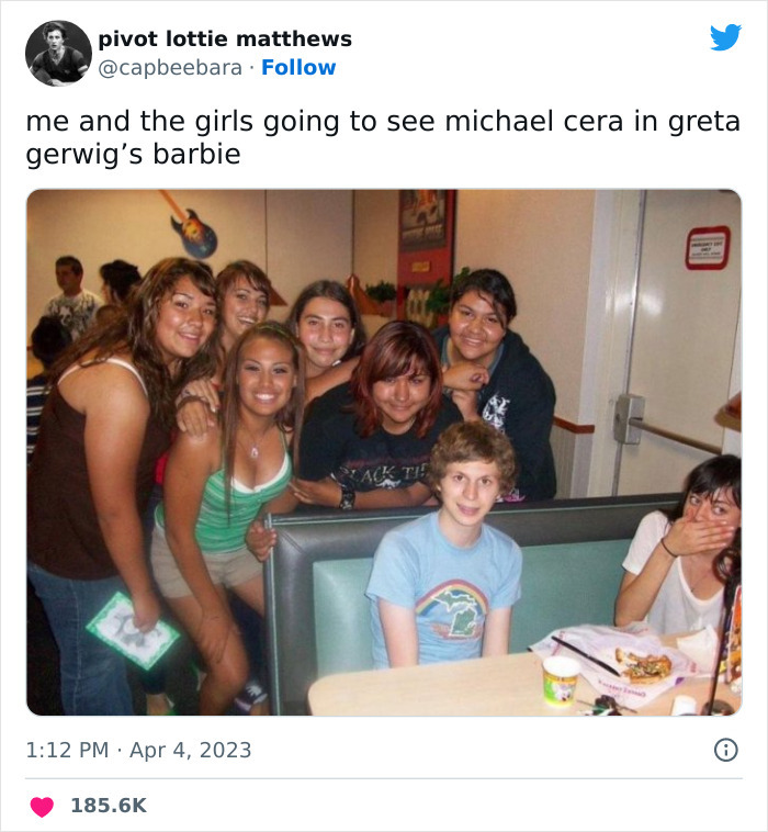 Group of friends posing in a restaurant, referencing Michael Cera in Greta Gerwig's Barbie movie meme.