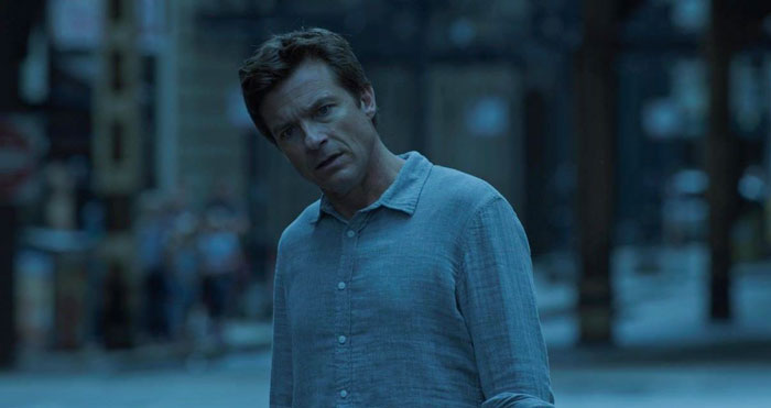 Marty wearing gray shirt looking from Ozark Sugarwood