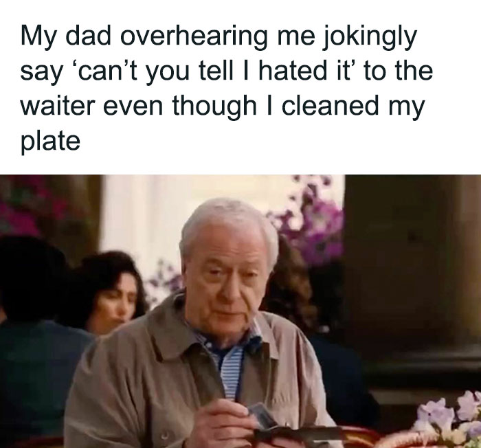 Elderly man in a restaurant reacting with a classic dad look, holding cutlery.