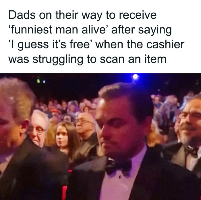 Man in a suit in an audience setting, representing classic dad humor about saying "I guess it's free" at the cashier.