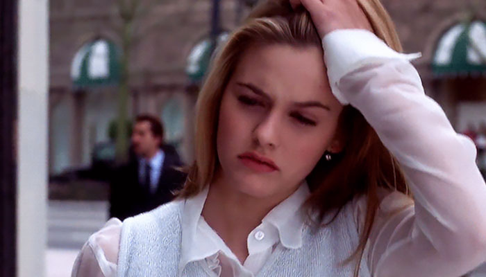 Cher wearing white shirt 