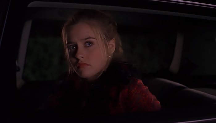 Cher wearing red jacket 