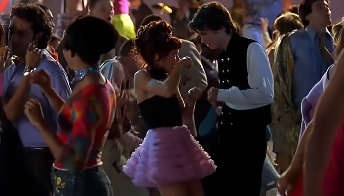 Tai wearing pink skirt 