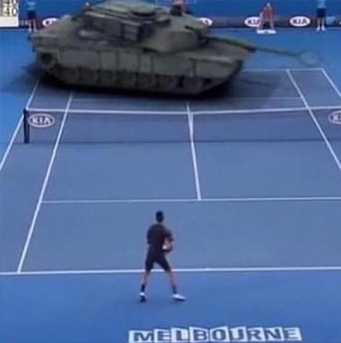 Cursed meme featuring a tank humorously positioned on a tennis court during play.