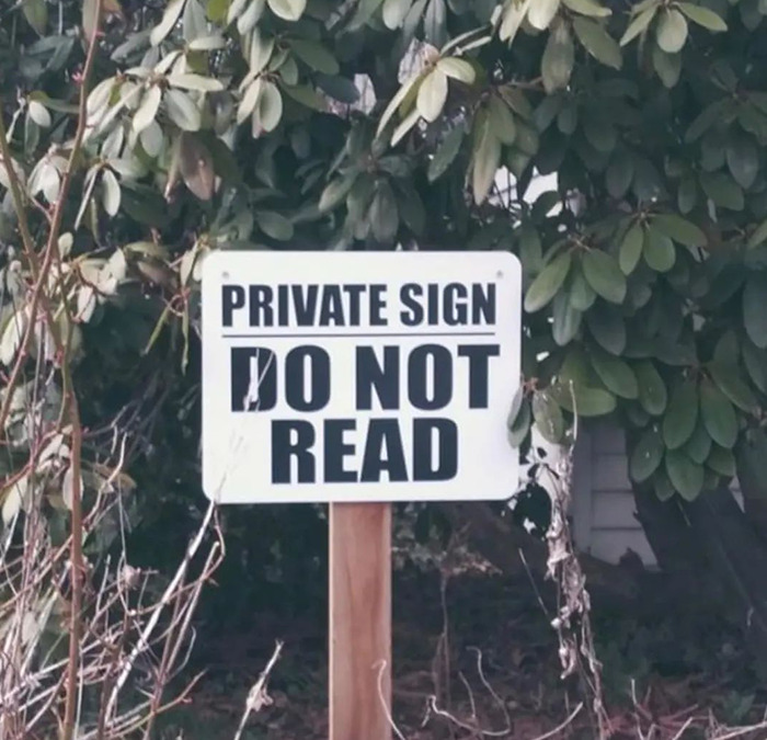 Cursed meme featuring a sign reading "Private Sign Do Not Read" in a garden setting.