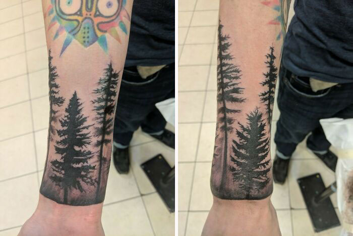 Wrist tattoo design featuring detailed pine trees on an arm in a tiled room.
