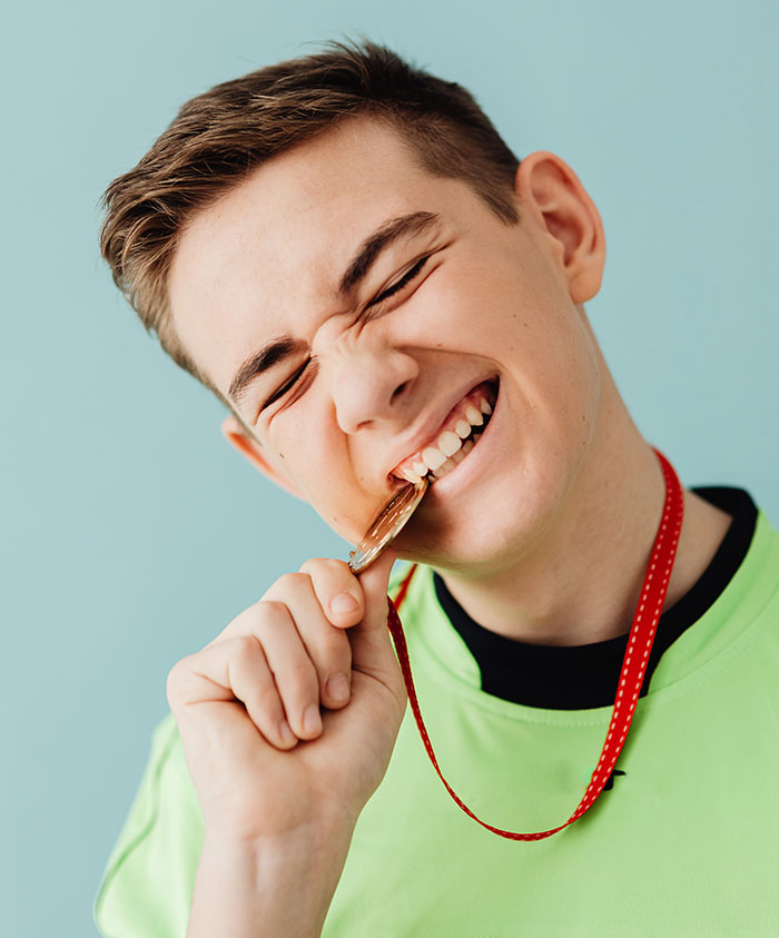 Boy bites medal
