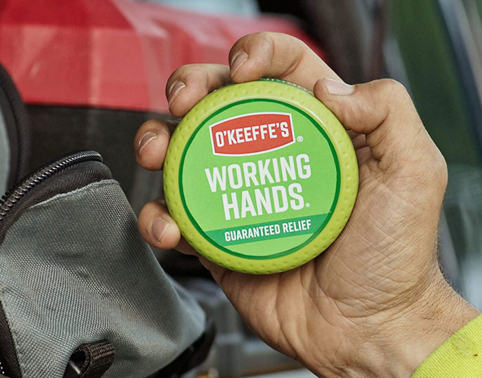 Man holding green hand cream 