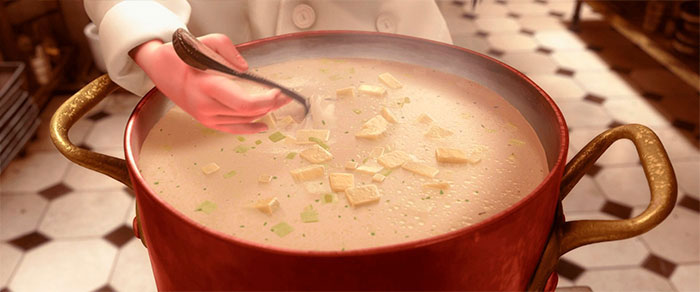 Human hand stirs the soup