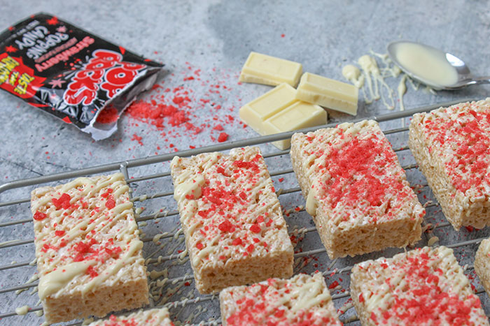 Rice Krispie treats with white chocolate and red sprinkles, illustrating the fun food history of snacks.