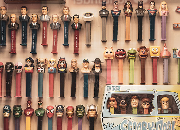 Collection of various PEZ dispensers, highlighting a fun food history fact.