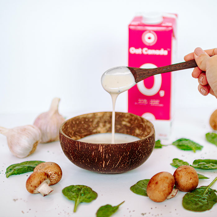 Béchamel Sauce in a bowl made of wood
