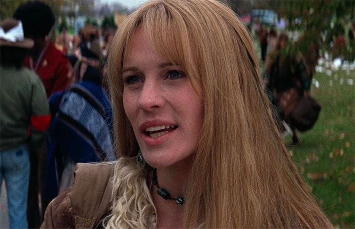 Jenny wearing a brown jacket in an outdoor setting, captured in a scene related to Forrest Gump quotes collection.