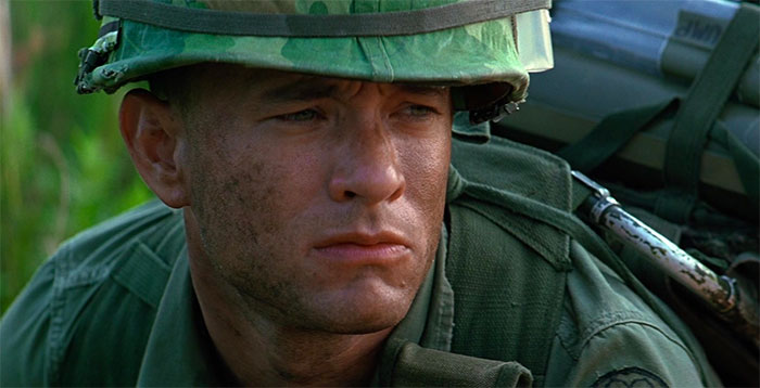 Forrest Gump in military uniform, displaying a serious expression, representing iconic Forrest Gump quotes and scenes.