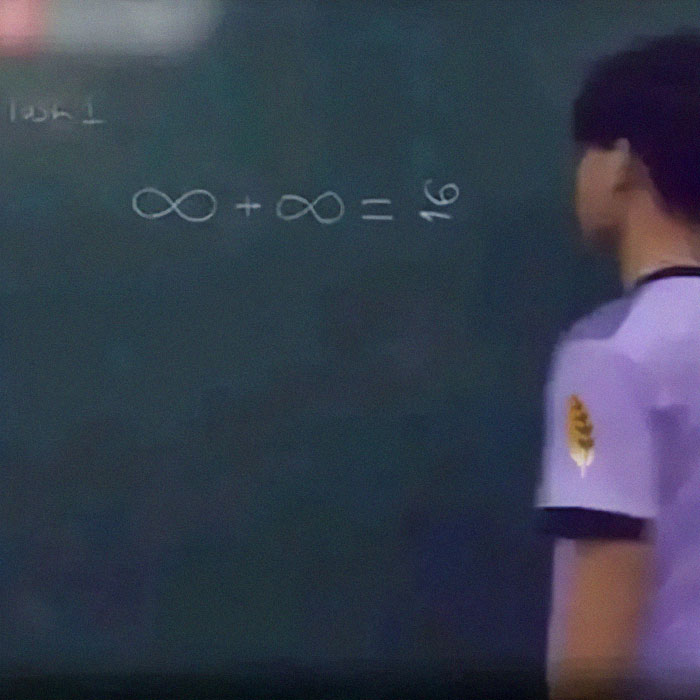 Student laughs at math meme drawing of infinity equation on chalkboard.