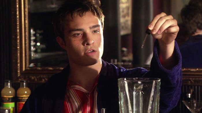 Chuck wearing purple robe making smoothie 