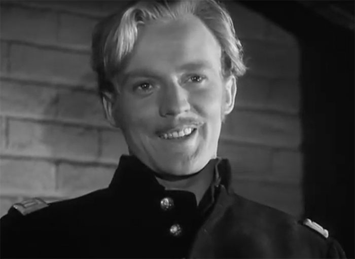 Errol Flynn in movie They Died With Their Boots On smiling