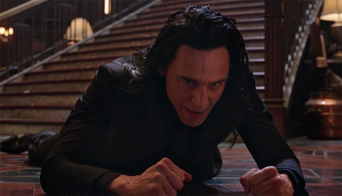 Loki lying down on the floor near the stairs