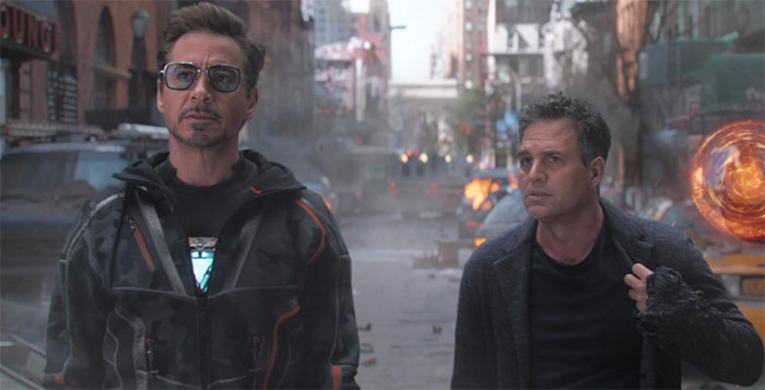 Tony Stark with a man in the city